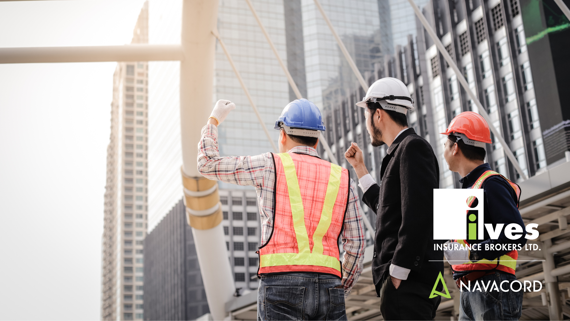 Construction workers wearing PPE on a job site, emphasizing the importance of safety programs to reduce workers' compensation costs and improve workplace safety.